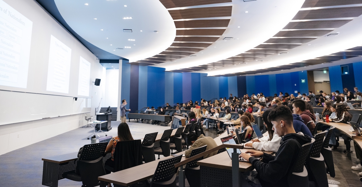 students gathered in a lecture hall 